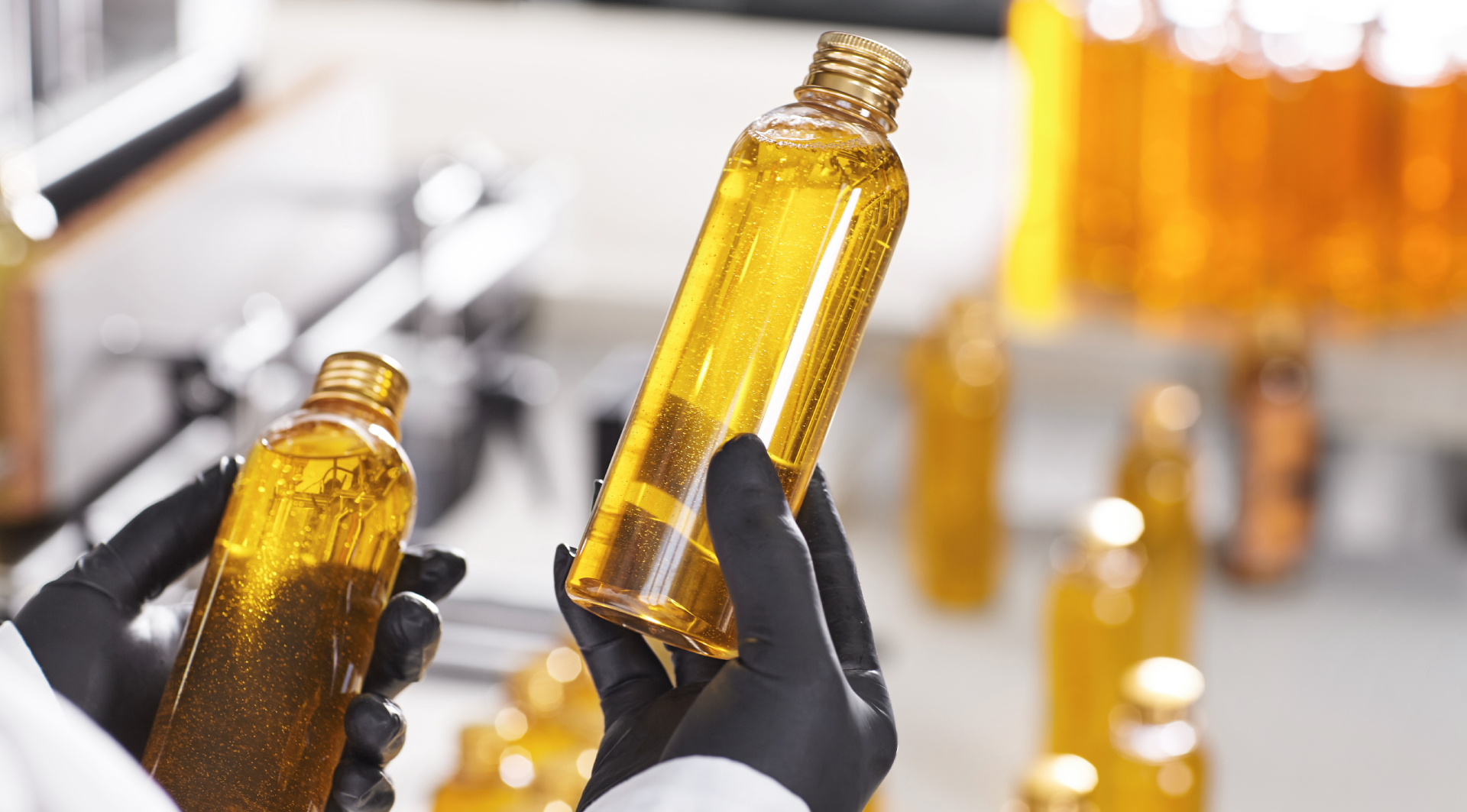 Golden oil sample bottles representing feed grade residue oil applications